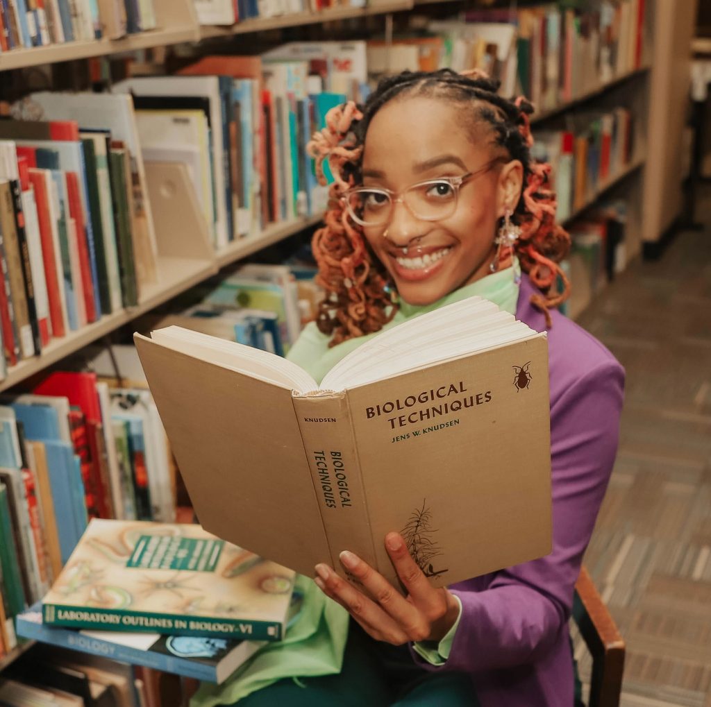 Headshot of a woman reading a book