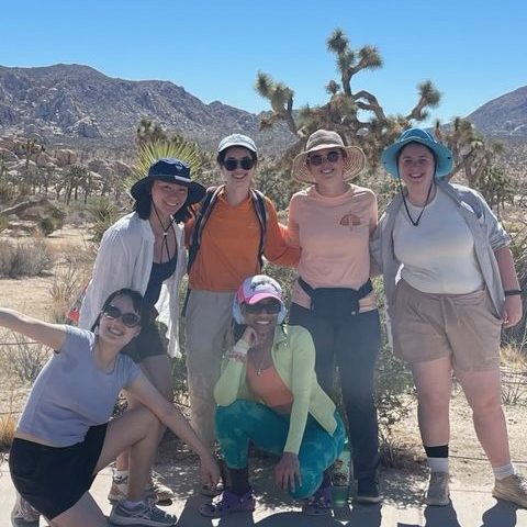 Photo of a group in front of a Joshua tree